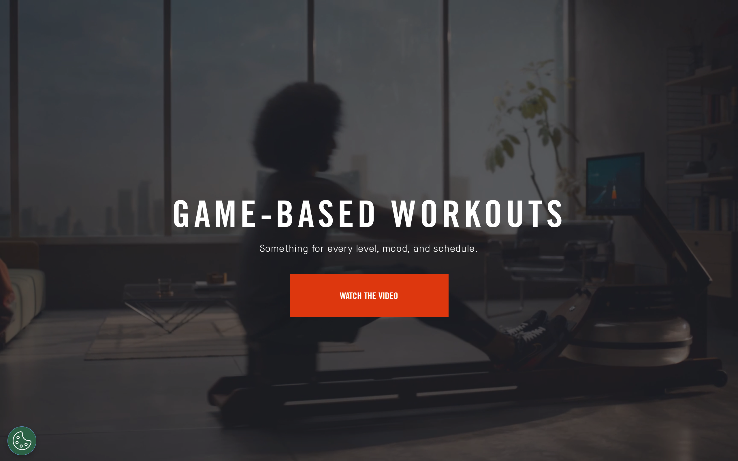 Ergatta's game-based workouts page with a dim photo of a rower and a button to watch the video