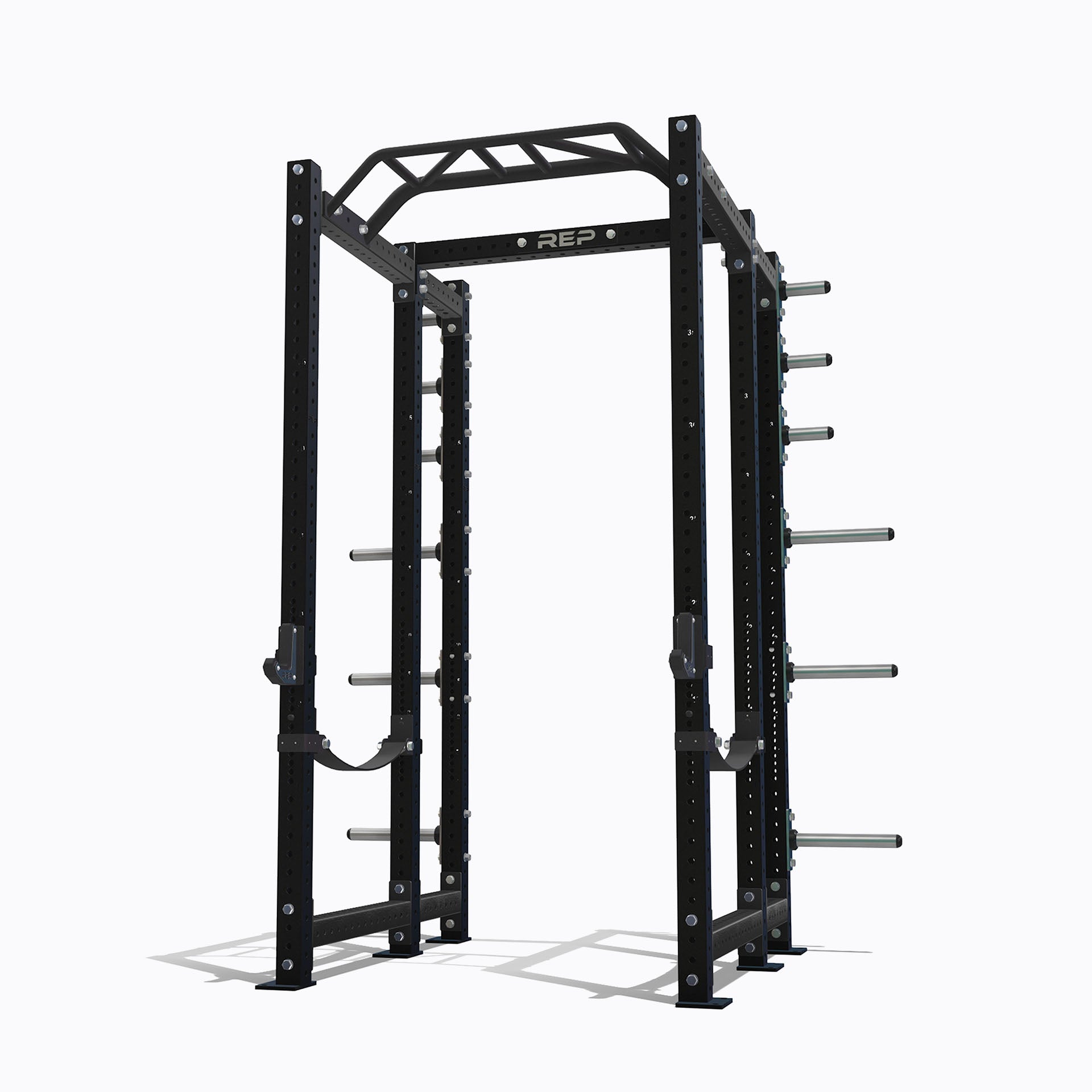 The REP PR-4000 power rack standing on a white background, showing a crossbar across the top and holes through the uprights